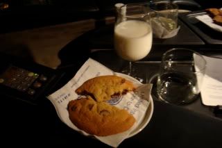 a cookie and milk on a table