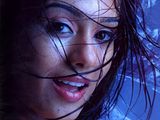 Amrita RAO wet with her hair all over the face wearing a high lipstick