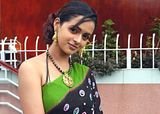 Bhavana looking very hot in her nice saree one side topless with a big necklase