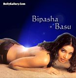 Bipasha Basu lying naked in sand exposing her bare back