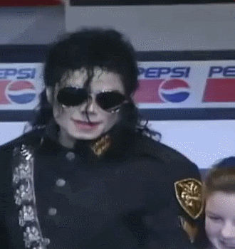 Michael-Jackson-Receiving-Check-For-The-Heal-The-World-Foundation-michael-jackson-16233687-330-350.gif